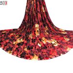 پارچه لباس زنانه مخمل سنگ دار رنگ قرمز 2 متری